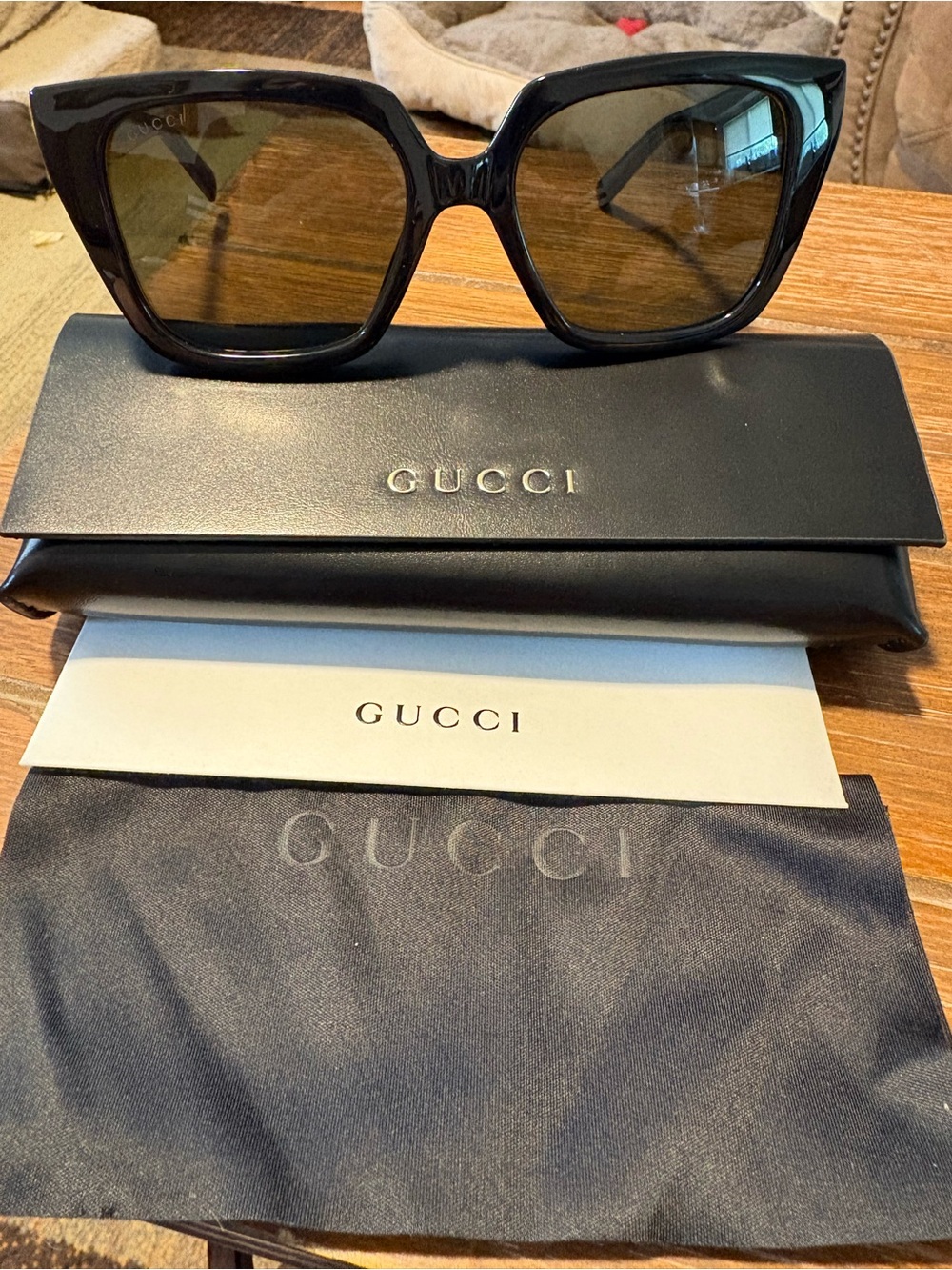 Gucci Men’s Black Frame Sunglasses with Brown Lenses